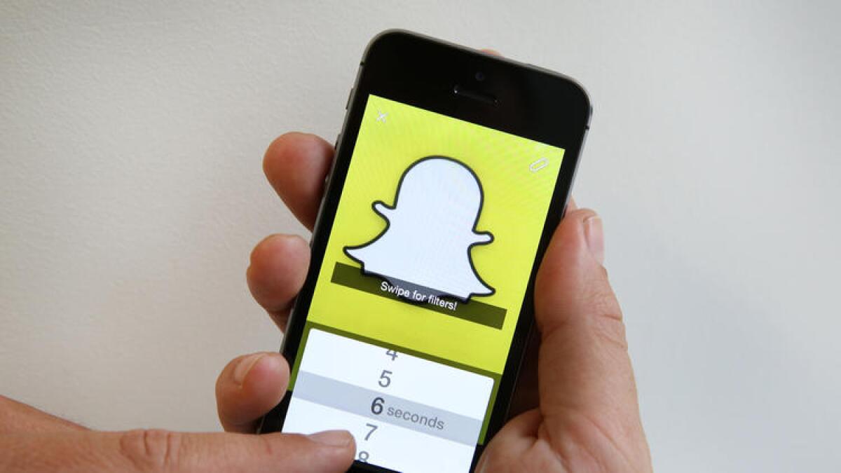 Snapchat allows users' messages and photos to disappear seconds after they're displayed. The Los Angeles Times' description of the service has evolved over the years.