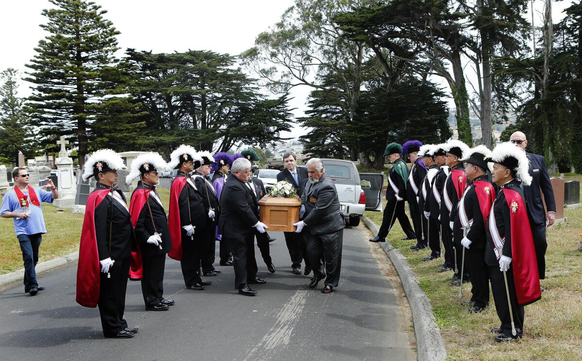 Members of the Knights of Columbus 4th Degree, from the Bay Area, stand at attention as Miranda Eve's casket is carried.
