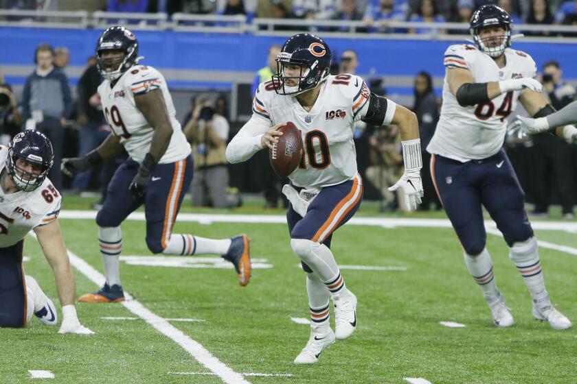 Bears quarterback Mitch Trubisky scrambles during the second half of the game against the Lions on Nov. 28, 2019, in Detroit.