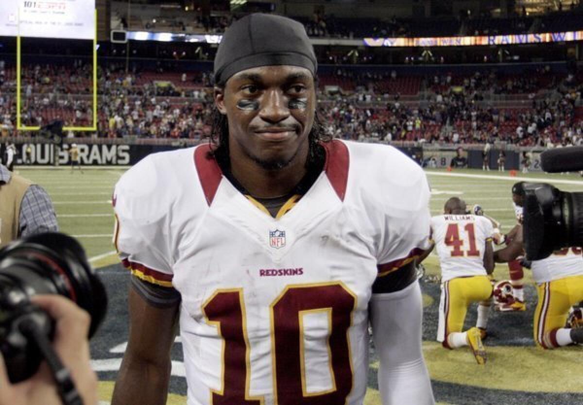 Washington quarterback Robert Griffin III, shown after a Redskins loss in 2012, took to Twitter to vent his frustrations after his alma mater, Baylor, lost in the NCAA women's tournament.