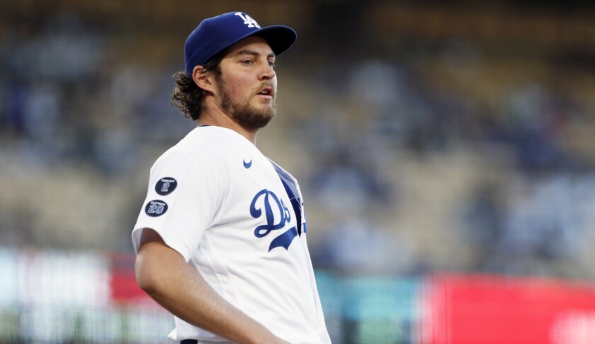 Los Angeles Dodgers starting pitcher Trevor Bauer covers first base.