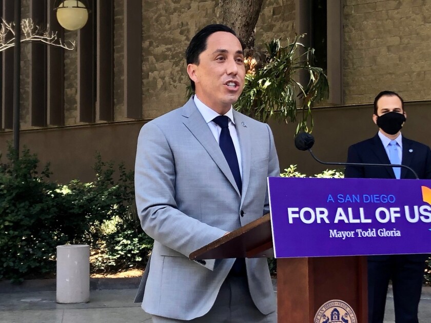 San Diego Mayor Todd Gloria spoke at a podium that reads A San Diego For All of Us in March.