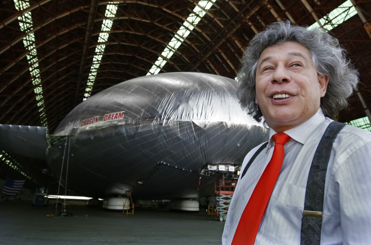 Igor Pasternak, chief executive of Worldwide Aeros Corp., stands near the company's experimental cargo-hauling airship in a World War II-era blimp hangar at the former Tustin Marine Corps Air Station.