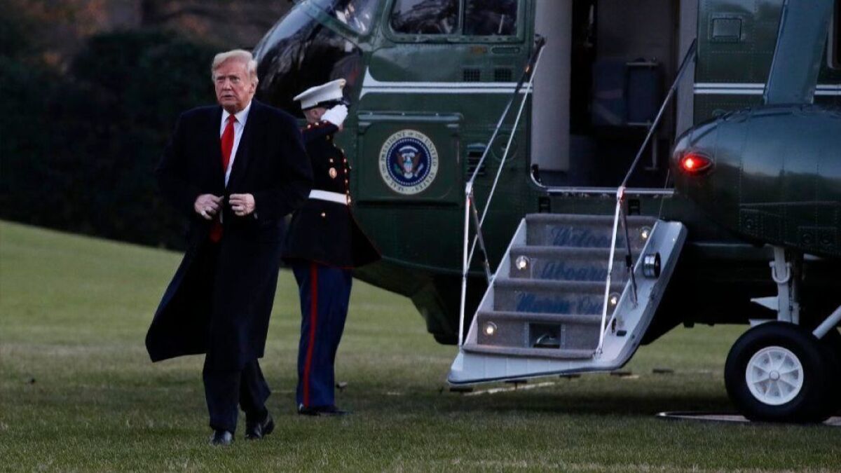 President Trump exits Marine One as he returned to the White House on Friday.