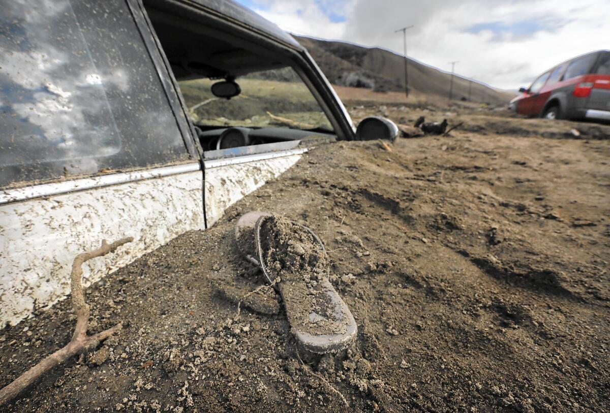 A sandal is left behind where a Mini Cooper was buried in a mudslide in Elizabeth Lake.
