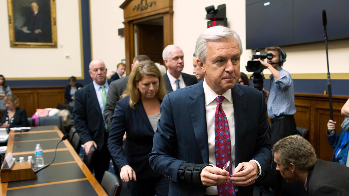Wells Fargo CEO John Stumpf leaves a hearing room on Capitol Hill on Sept. 29 after testifying before the House Financial Services Committee, which was investigating Wells Fargo's opening of unauthorized customer accounts.
