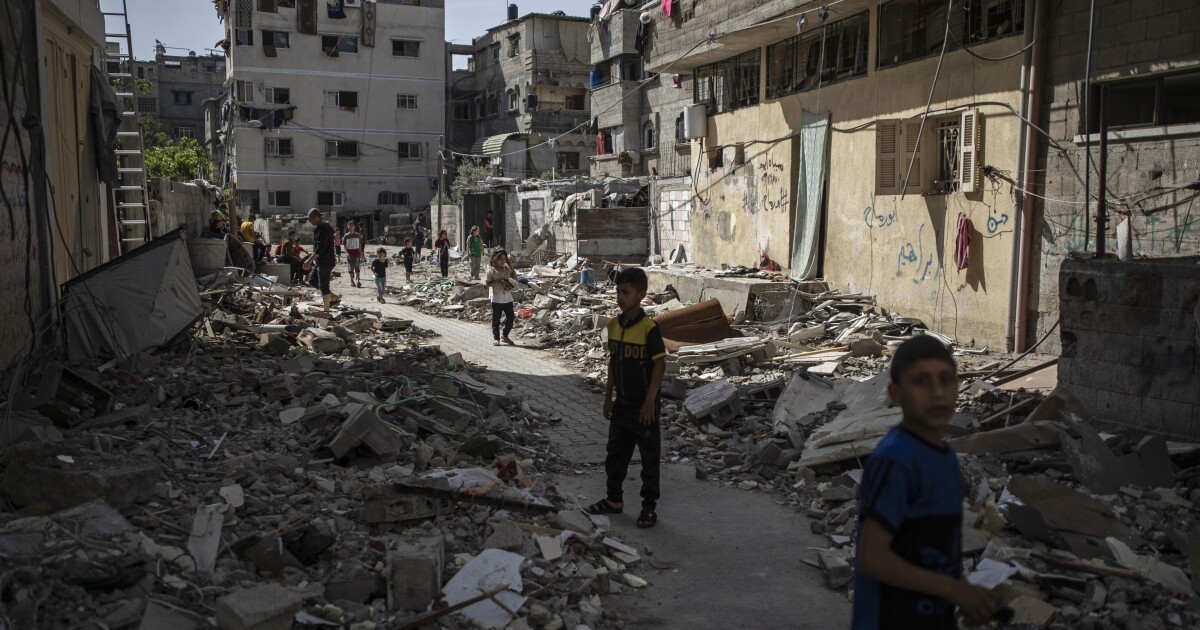 In Gaza, children hide and buildings fall from Israeli air strikes In Gaza, children hide and buildings fall from Israeli air strikes