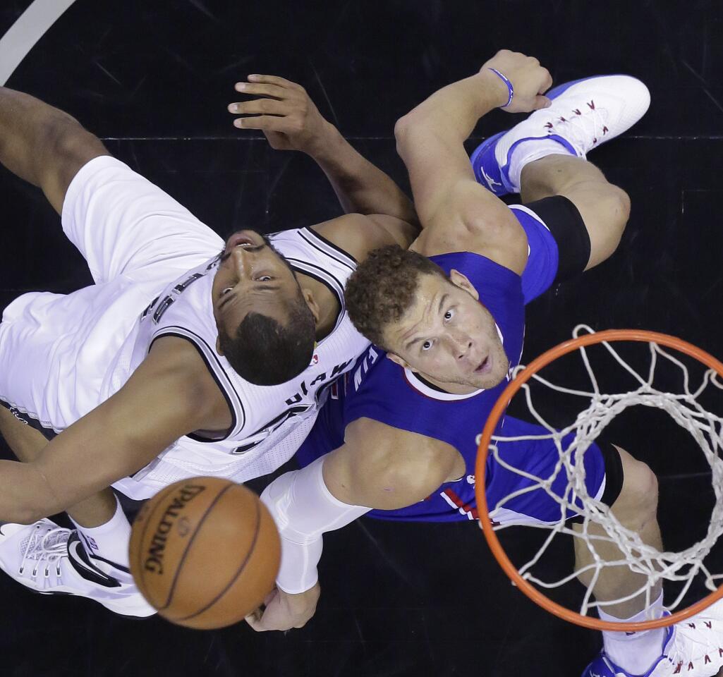 Spurs forward Boris Diaw and Clippers power forward Blake Griffin eye a rebound during the second half of Game 6. The Clippers won 102-96.