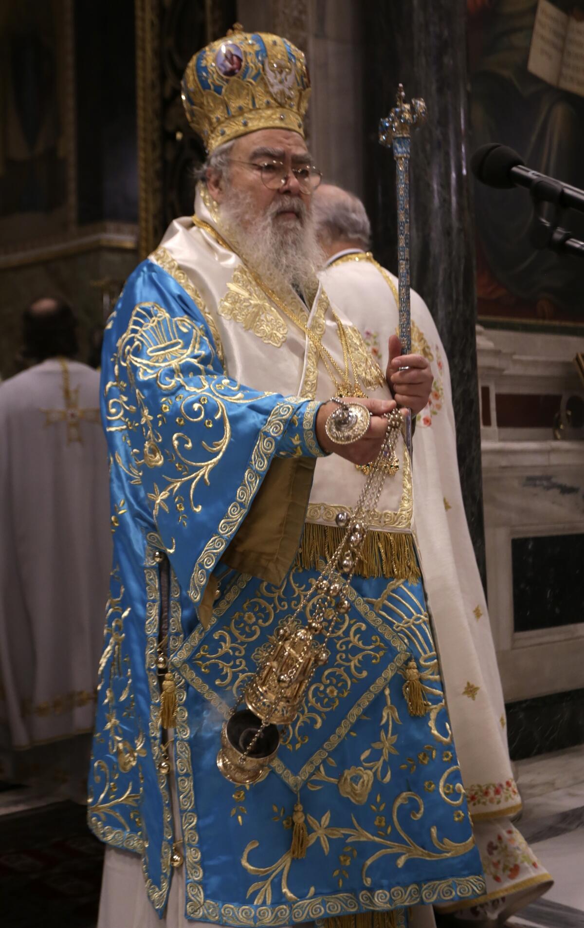 FILE - Chrysostomos, Metropolitan Bishop of Dodoni ordains a priest at Athens Cathedral, Greece, on Monday, Oct. 14, 2019. Chrysostomos' statement in a TV interview Friday, Sept, 2, 2022 that a woman is not raped without her consent and that there can be no conception from a rape have been widely condemned by politicians and by the Greek Orthodox Church itself. (Xristos Bonis/Eurokinissi via AP, File)