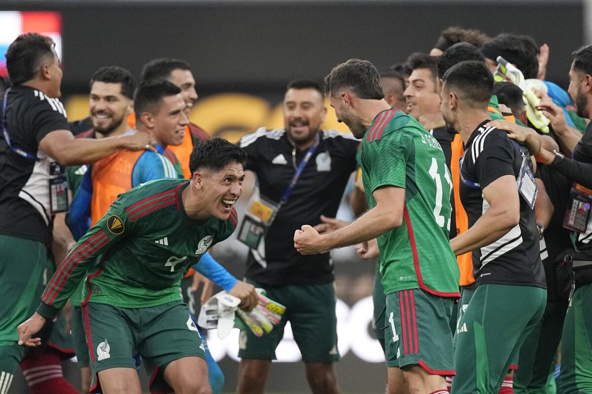 Mexico players celebrate after their 1-0 Gold Cup win over Panama on Sunday at SoFi Stadium.