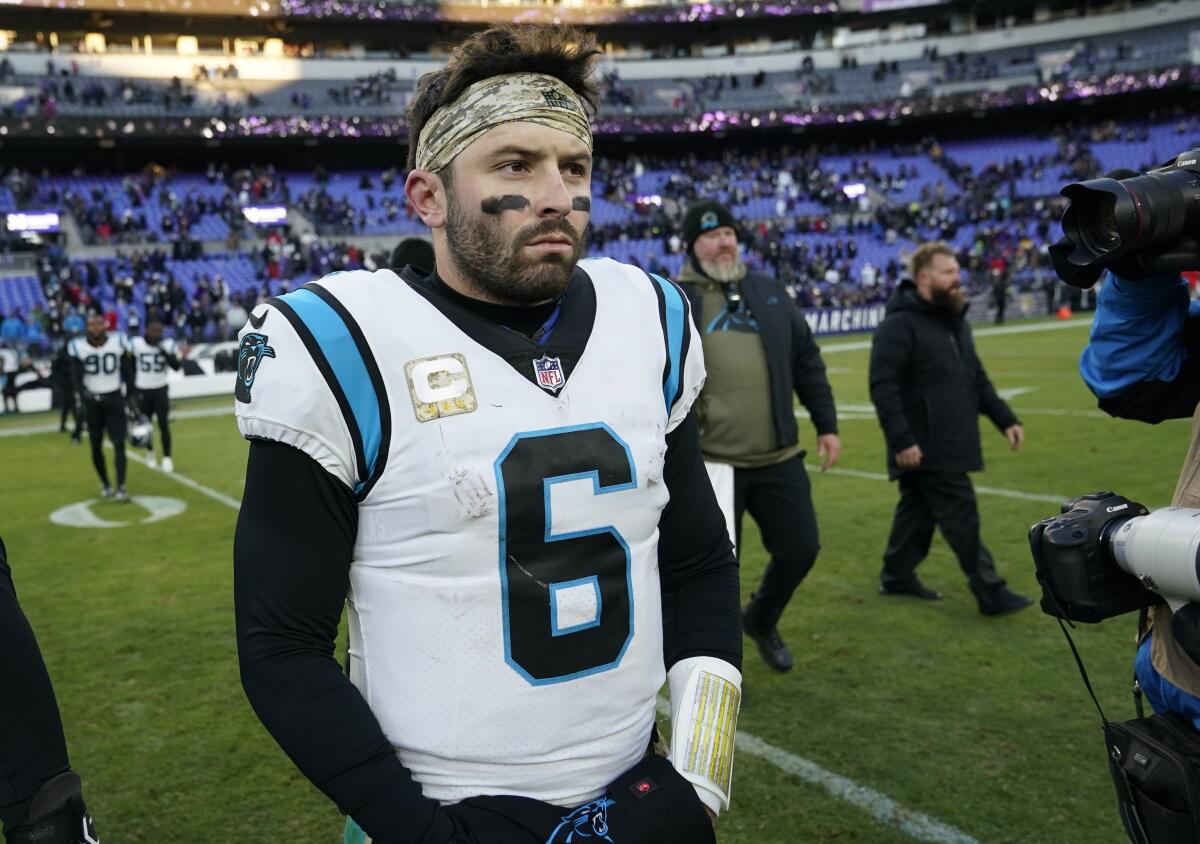Carolina Panthers quarterback Baker Mayfield walks off the field after a loss to the Baltimore Ravens 
