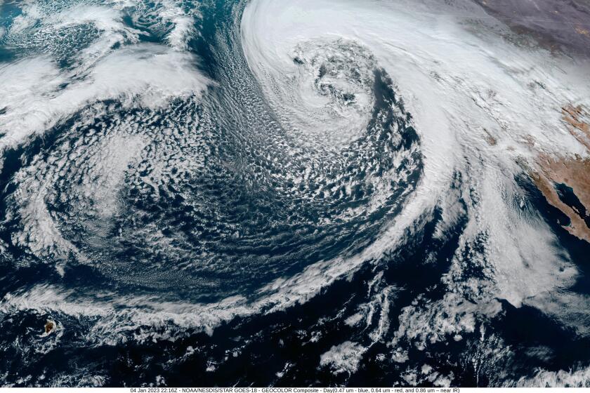 A satellite from NOAA shows a composite image of a mid-latitude cyclone.