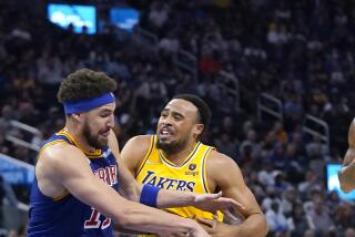 Los Angeles Lakers guard Talen Horton-Tucker, right, is fouled by Golden State Warriors guard Klay Thompson.