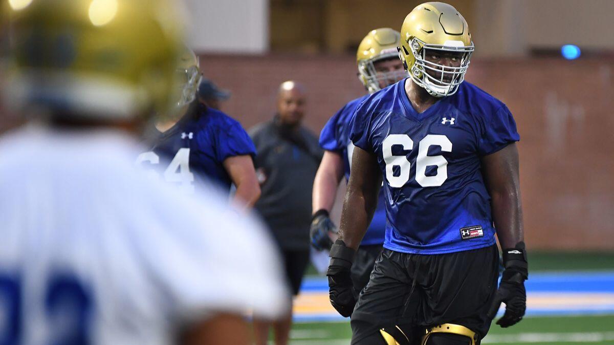 UCLA football's Sunny Odogwu practices with the team at the Bruins' facility on Aug 2. (Wally Skalij / Los Angeles Times)