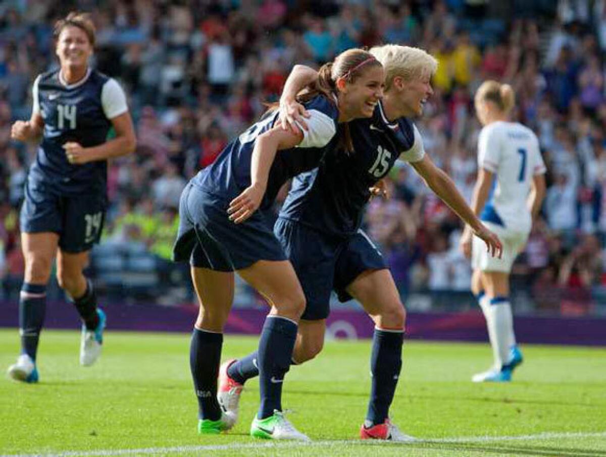 United States' Megan Rapinoe, right and Alex Morgan celebrate together after Morgan scores her second goal.