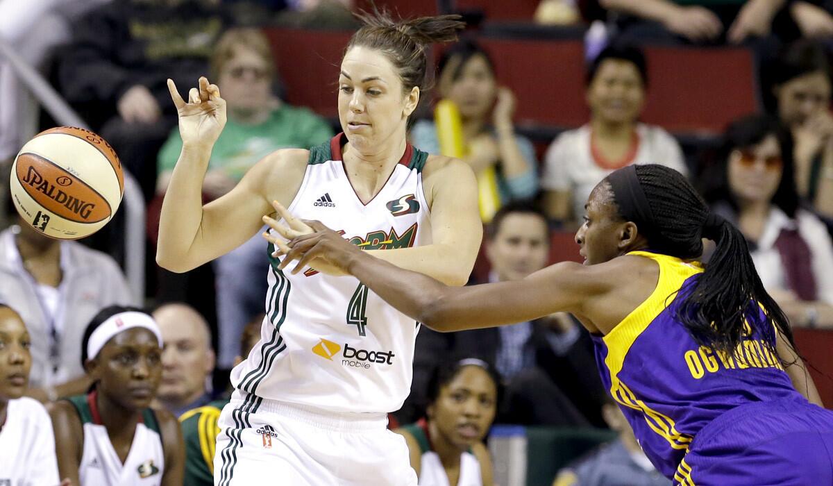 Sparks forward Nneka Ogwumike knocks the ball away from Storm guard Jenna O'Hea in the first half Friday.