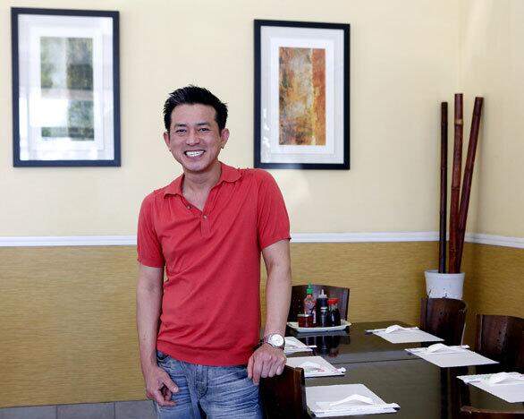 Brian Huynh, owner of Huynh Restaurant in Little Saigon, says he loved working in his spare time at Ha-Noi with his aunt and uncle when he had a job in banking.
