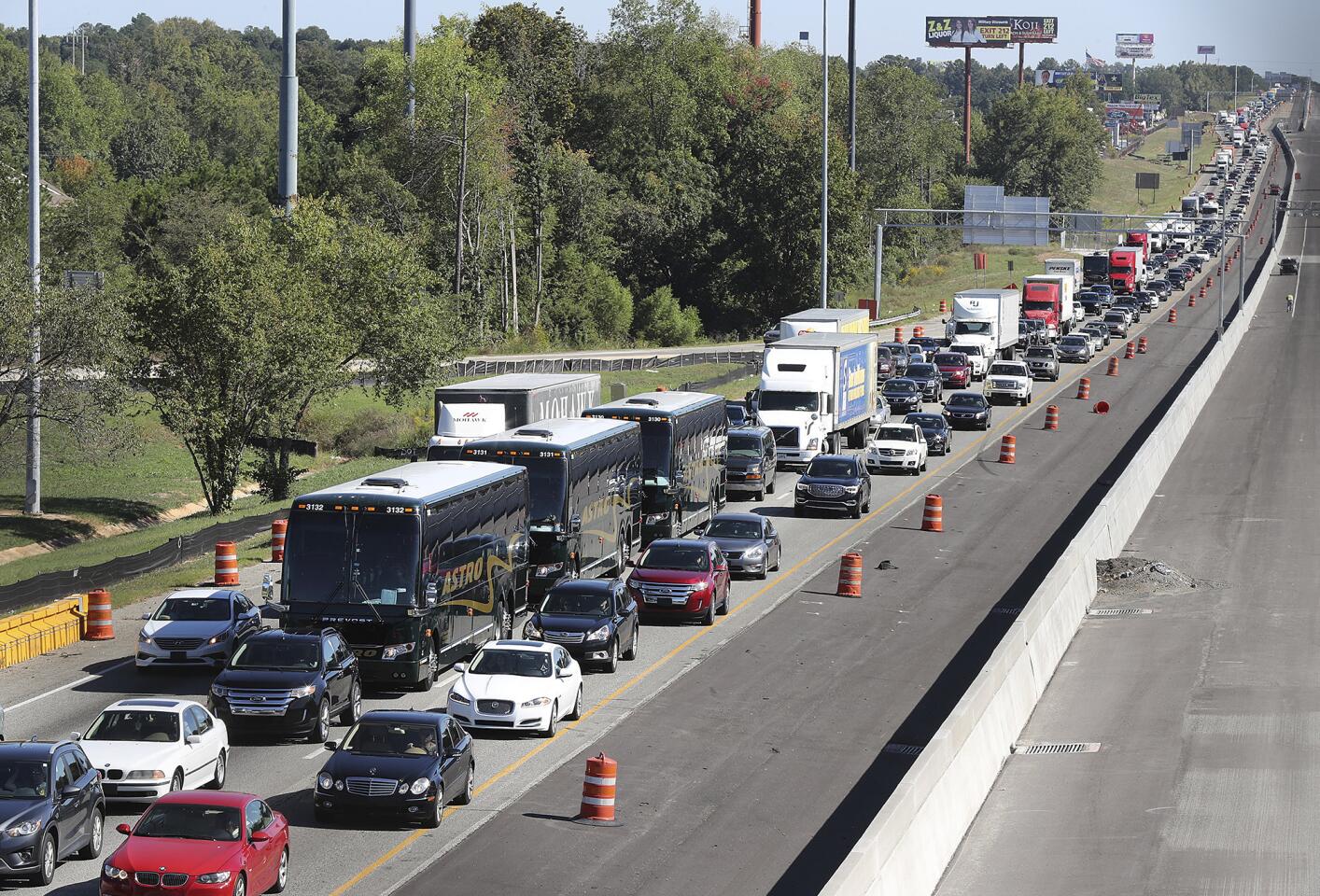 Traffic stacks up on I-75 North fleeing the coast and Hurricane Matthew on Thursday, Oct. 6, 2016, near McDonough, Georgia. Jim Butterworth, director at the Georgia Emergency Management and Homeland Security Agency, says he expects the storm to arrive in coastal Georgia late Friday and continue through Saturday night.