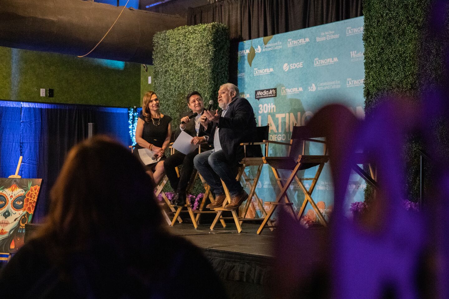 Paola Hernandez-Jiao (far left) and Luis Cruz (second to left) of The San Diego Union-Tribune host a discussion with Actor Joaquin Cosio (right) during opening night of the 30th annual San Diego Latino Film Festival at Westfield Mission Valley Mall in San Diego, CA on Thursday, March 9, 2023.