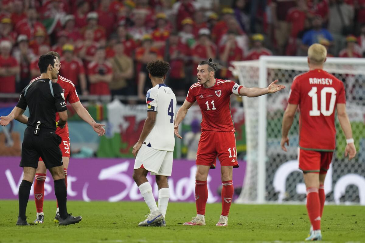 Wales forward Gareth Bale pleads his case before being shown a yellow card in the first half.