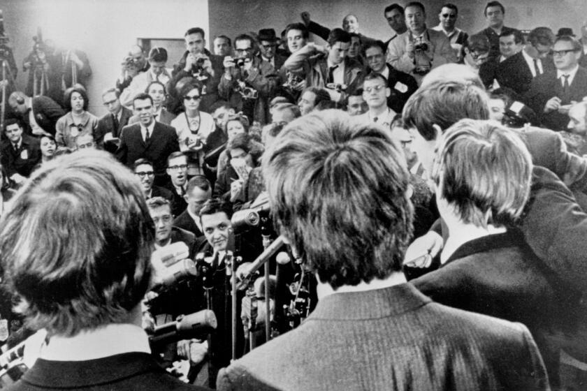 The Beatles face the media at JFK Airport after their arrival in America on Feb. 7, 1964. The band's early years will be the focus of a forthcoming Ron Howard-directed documentary called "The Beatles: Eight Days a Week - the Touring Years."