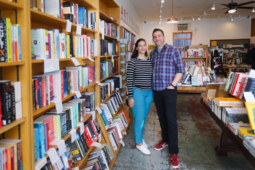 Jennifer Powell, left, and her husband, Seth Marko, right, co-owners of The Book Catapult, in South Park, January 30, 2020 in San Diego, California.