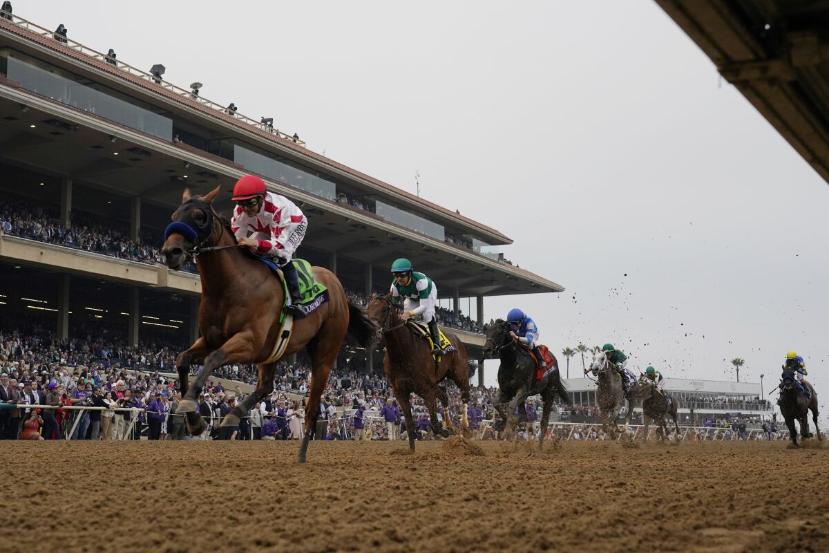 Mike Smith, left, rides Corniche to win the Breeders' Cup Juvenile on Nov. 5, 2021, at Del Mar.
