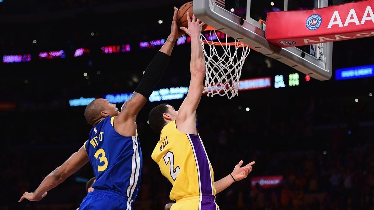 Lonzo Ball has his last-second attempt to tie the game in overtime blocked by David West during a 116-114 Warriors win at Staples Center on Monday.
