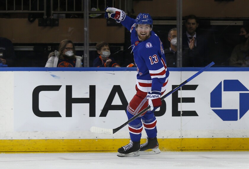 New York Rangers' Alexis Lafreniere (13) celebrates his goal against the Edmonton Oilers during the first period of an NHL hockey game Monday, Jan. 3, 2022, in New York. (AP Photo/John Munson)