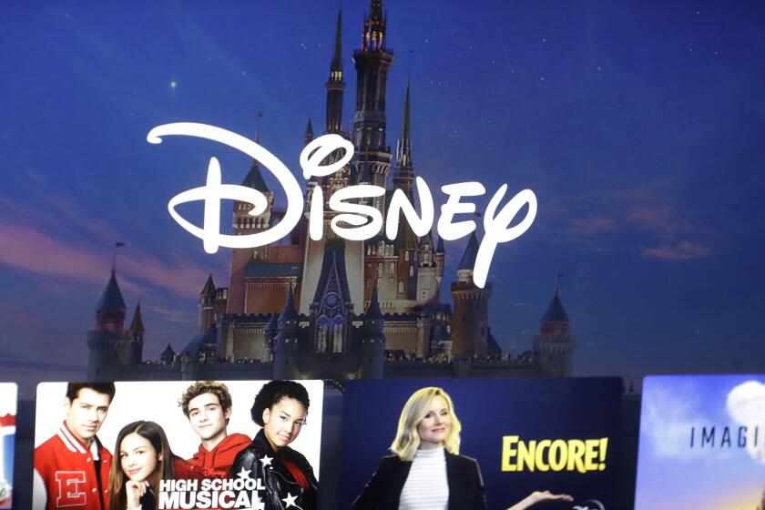 FILE - In this Nov. 13, 2019, photo, a Disney logo forms part of a menu for the Disney Plus movie and entertainment streaming service on a computer screen in Walpole, Mass. Password-sharing crackdowns are becoming more and more common in the streaming world today. And Disney Plus is following suit. In an email sent to the users in Canada, Disney announced upcoming restrictions on Canadian subscribers’ ability to share login credentials outside of their household — set to go into effect for most Canadian users on Nov. 1, 2023. (AP Photo/Steven Senne, File)