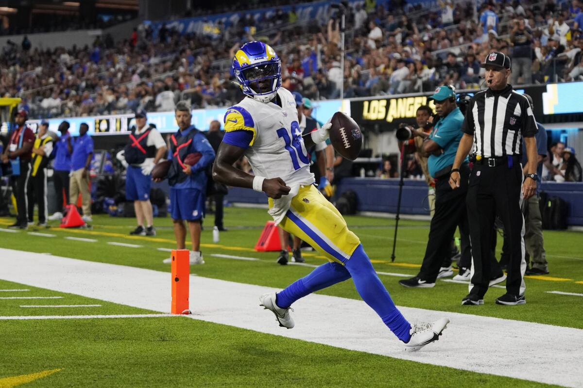 Los Angeles Rams quarterback Bryce Perkins (16) scores a touchdown during the second half of the team's preseason NFL football game against the Los Angeles Chargers on Saturday, Aug. 13, 2022, in Inglewood, Calif. (AP Photo/Mark J. Terrill)