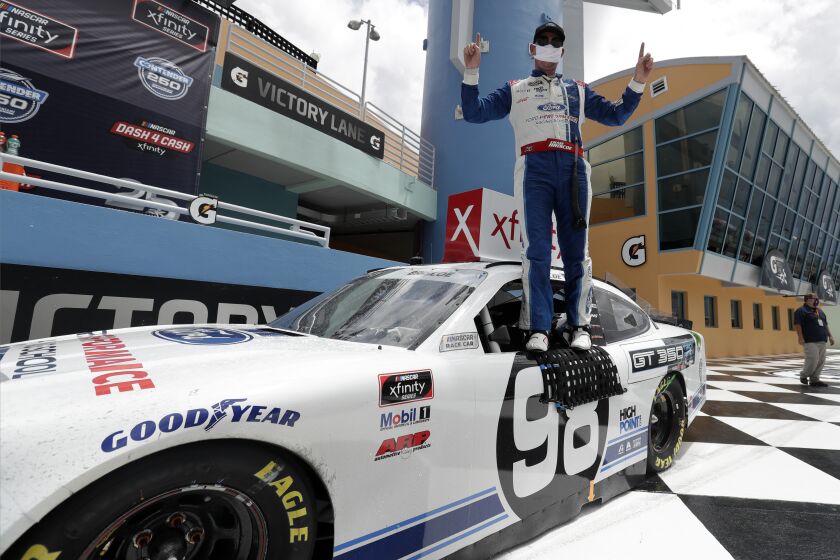 Chase Briscoe celebrates after winning a NASCAR Xfinity Series auto race Sunday, June 14, 2020, in Homestead, Fla. (AP Photo/Wilfredo Lee)