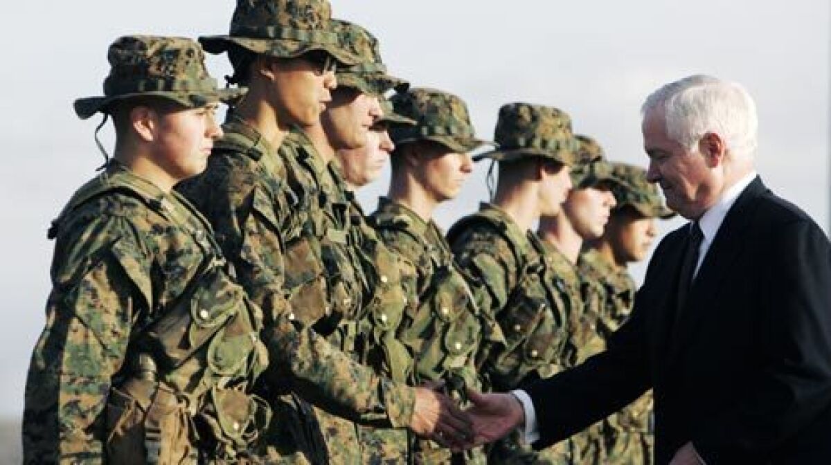 Defense Secretary Robert M. Gates greets Marine recruits at Camp Pendleton in Oceanside on Monday. In his first official visit to Southern California, he emphasized the sacrifices made by families of sailors and Marines.