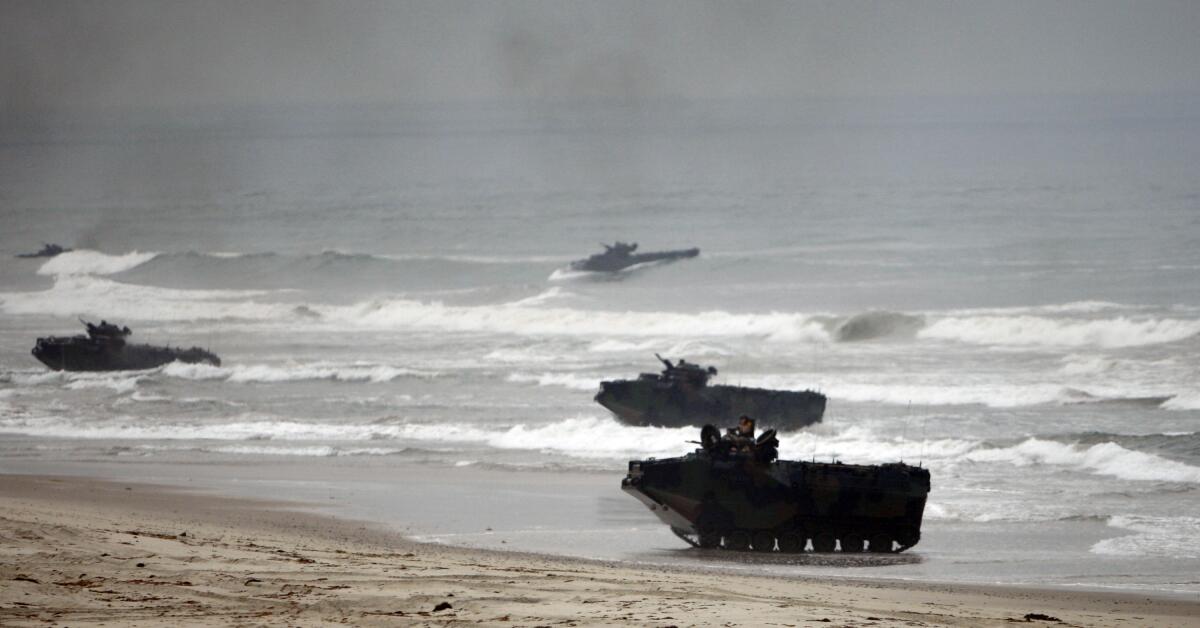 Amphibious assault vehicles storm Red Beach during exercises at Camp Pendleton.
