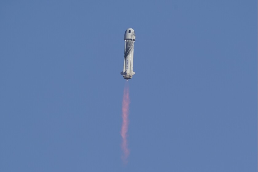 FILE - Blue Origin's New Shepard rocket launches carrying passengers William Shatner, Chris Boshuizen, Audrey Powers and Glen de Vries from its spaceport near Van Horn, Texas, Wednesday, Oct. 13, 2021. TV celebrity and former football great Michael Strahan is going to have to wait another few days before rocketing into space. Strahan was supposed to blast off Thursday, Dec 9, 2021, from West Texas with five others. But on Wednesday, Jeff Bezos’ space travel company, Blue Origin, bumped the launch to Saturday because of high wind. (AP Photo/LM Otero, File)