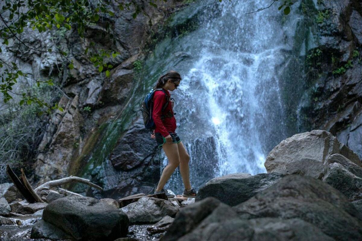Samantha McArthy of Oconomowoc, Wisc., gingerly makes her way through Sturtevant Falls in Angeles National Forest.