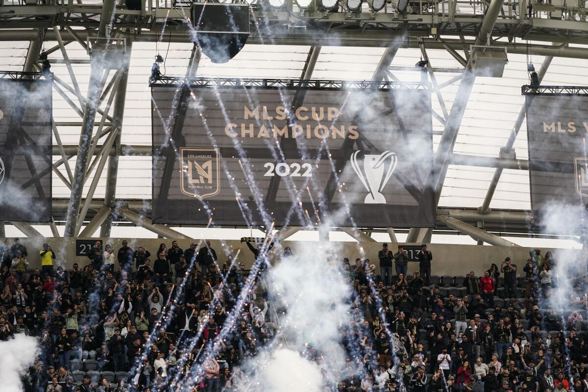 A banner celebrating LAFC's 2022 MLS Cup championship is unveiled at BMO Stadium before Saturday's win over Portland.