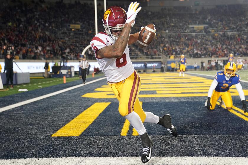 BERKELEY, CALIFORNIA - NOVEMBER 16: Michael Pittman Jr. #6 of the USC Trojans catches a touchdown pass over Elijah Hicks #3 of the California Golden Bears during the second quarter of an NCAA football game at California Memorial Stadium on November 16, 2019 in Berkeley, California. (Photo by Thearon W. Henderson/Getty Images)