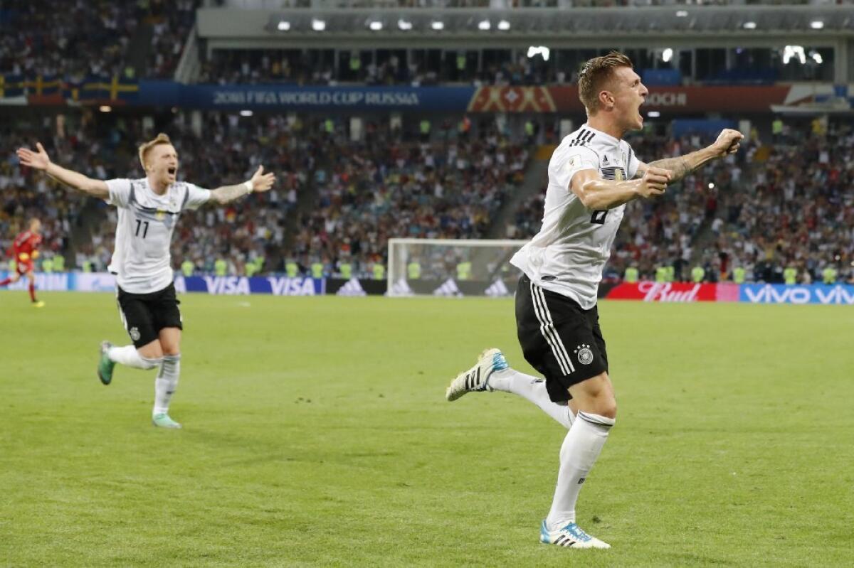 Germany's Toni Kroos, right, celebrates after scoring his side's second goal during a Group F match against Sweden on June 23.