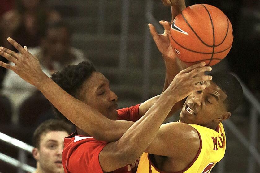 Trojans De'Anthony Melton tangles with Matt Morgan of the Cornell Big Red at the Galen Center on Monday evening.