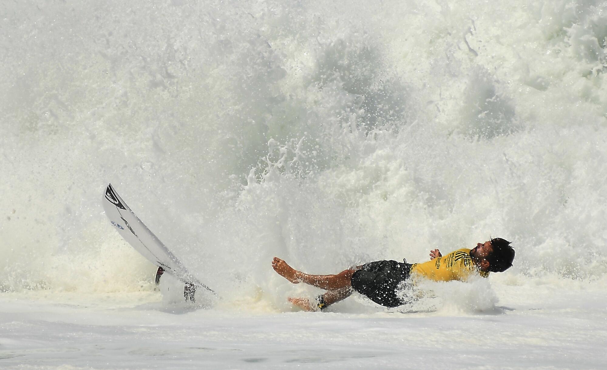 A surfer bails out of a wave in the ISA World Surfing Games at Surf City in El Salvador.