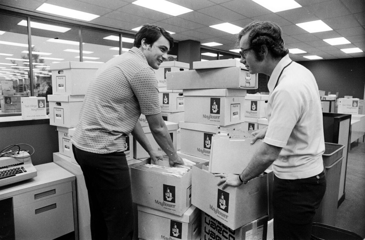 1973: Evening Tribune reporters Nick Canepa and Mark Monday unpacking in the Tribune newsroom.