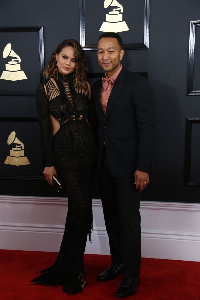 Chrissy Teigen and John Legend arrive at the 59th Grammy Awards.