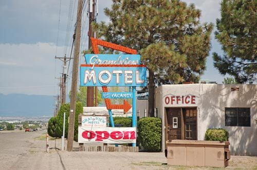 On the western fringe of Albuquerque, Route 66 follows Central Avenue past a procession of small motels with classic signs.