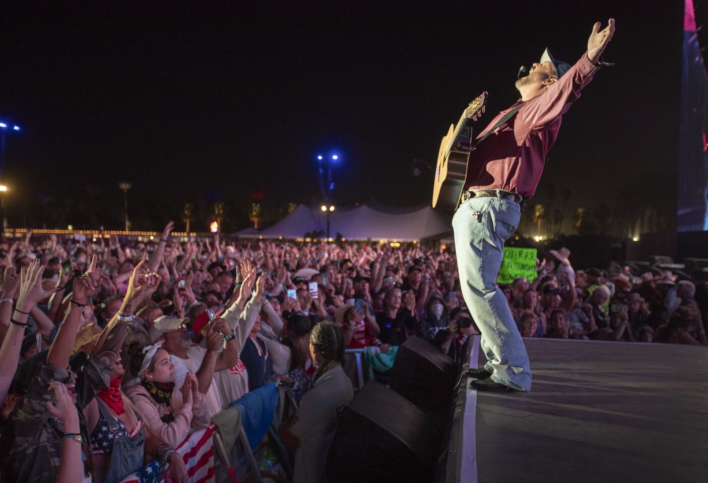 Fans applaud Garth Brooks at the festival in Indio on Sunday.