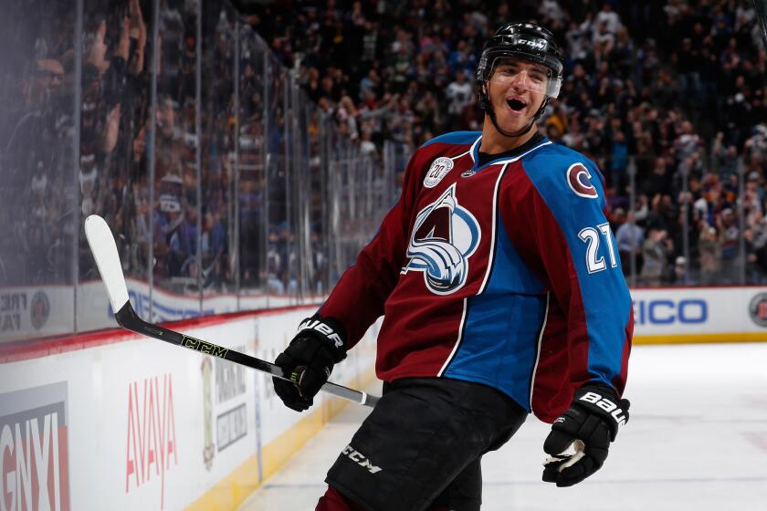 Avalanche forward Andreas Martinsen celebrates after scoring a second period goal against the Ducks.