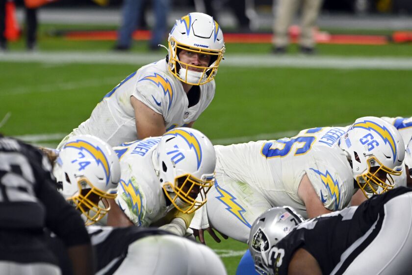 Los Angeles Chargers quarterback Justin Herbert (10) lines up against the Las Vegas Raiders during an NFL football game, Sunday, Dec. 17, 2020, in Las Vegas. (AP Photo/David Becker)