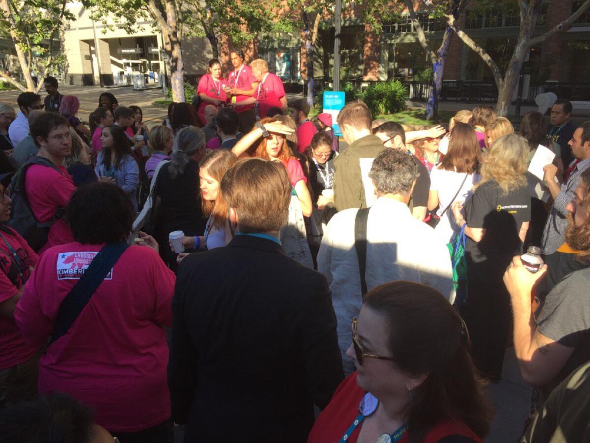 Supporters of Kimberly Ellis, who lost the California Democratic Party's race for chairperson, gather outside the Sacramento Convention Center on Sunday morning.