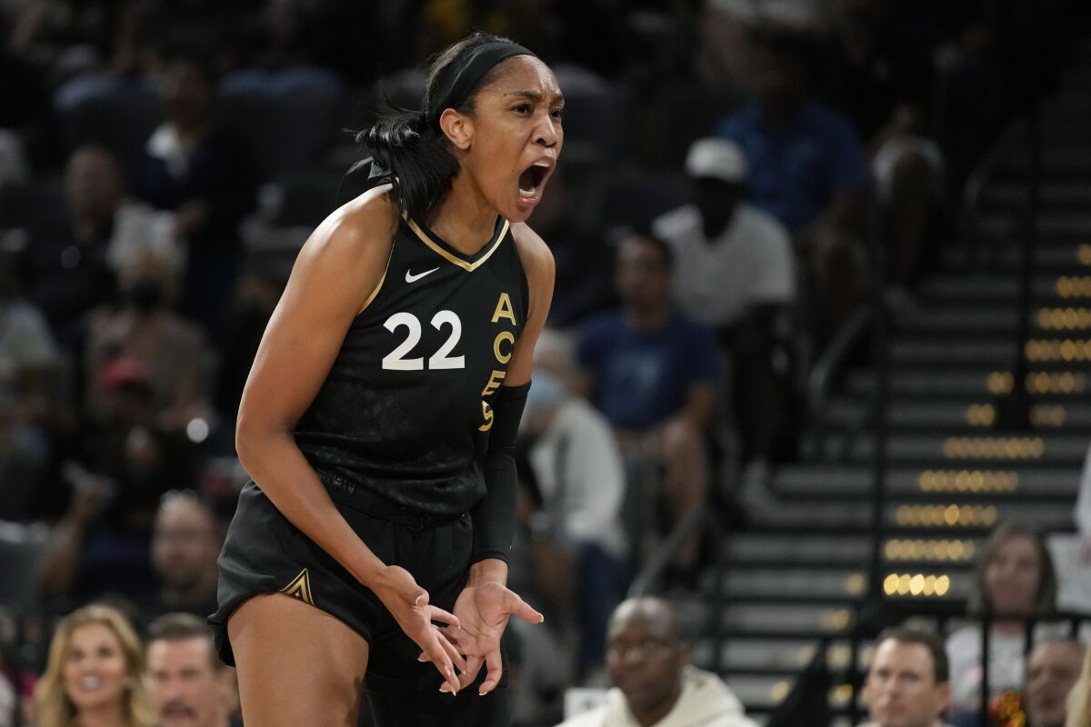 Las Vegas Aces forward A'ja Wilson (22) reacts after a play against the Phoenix Mercury during the first half in Game 1 of a WNBA basketball first-round playoff series Wednesday, Aug. 17, 2022, in Las Vegas. (AP Photo/John Locher)