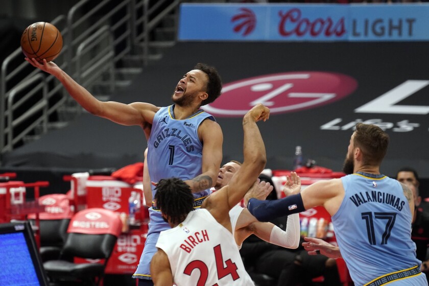Memphis Grizzlies forward Kyle Anderson (1) puts up a shot over Toronto Raptors center Khem Birch (24) during the first half of an NBA basketball game Saturday, May 8, 2021, in Tampa, Fla. (AP Photo/Chris O'Meara)